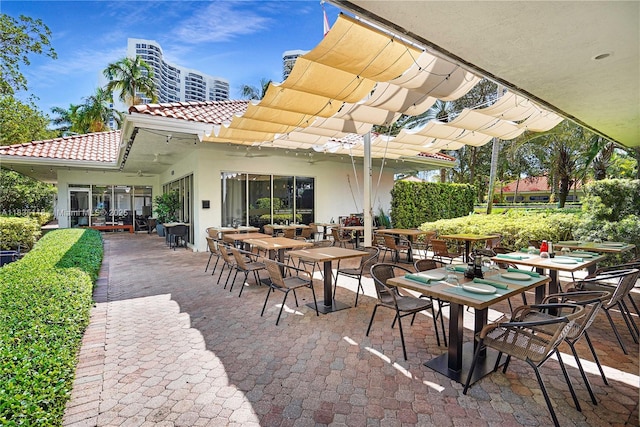 3530 Mystic Pointe Dr Unit 1714, Aventura, FL 33180 - view of patio / terrace featuring a pergola and outdoor dining area
