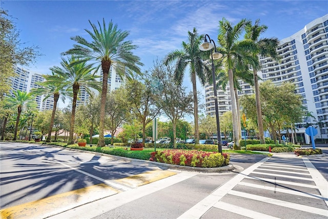 3530 Mystic Pointe Dr Unit 1714, Aventura, FL 33180 - view of asphalt street featuring street lighting, curbs, and traffic signs