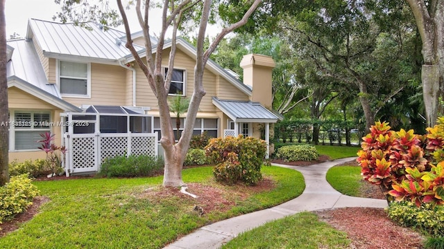 304 Andover Ct, Boynton Beach, FL 33436 - view of front of home featuring a standing seam roof, a metal roof, and a front lawn