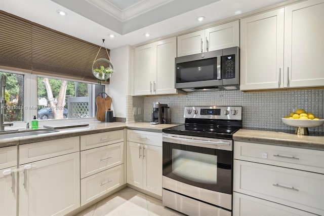 304 Andover Ct, Boynton Beach, FL 33436 - kitchen with appliances with stainless steel finishes, backsplash, ornamental molding, and recessed lighting