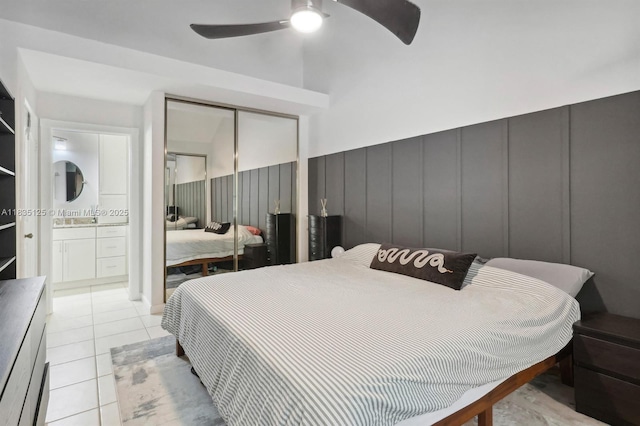 304 Andover Ct, Boynton Beach, FL 33436 - bedroom featuring a decorative wall, a closet, light tile patterned floors, ceiling fan, and ensuite bathroom