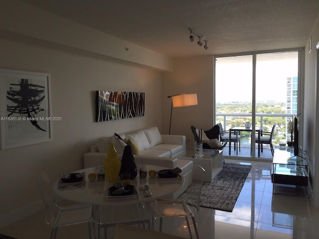 1871 NW S River Dr Unit 1904, Miami, FL 33125 - living room with expansive windows, rail lighting, and light tile patterned floors