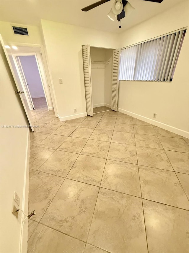 5012 SW 40th Ave Unit 5012, Fort Lauderdale, FL 33312 - unfurnished bedroom featuring a closet, a ceiling fan, and tile patterned floors