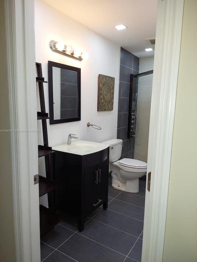 5012 SW 40th Ave Unit 5012, Fort Lauderdale, FL 33312 - full bathroom featuring a stall shower, tile patterned flooring, and vanity