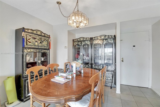 4350 Hillcrest Dr Unit 306, Hollywood, FL 33021 - dining area with a chandelier and light tile patterned floors