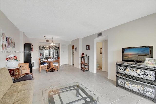 4350 Hillcrest Dr Unit 306, Hollywood, FL 33021 - living room with a chandelier and light tile patterned floors