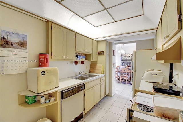 4350 Hillcrest Dr Unit 306, Hollywood, FL 33021 - kitchen featuring dishwasher, under cabinet range hood, light countertops, light tile patterned floors, and a chandelier