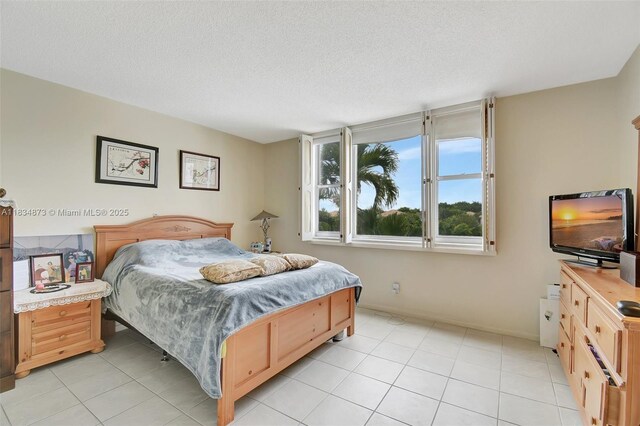 4350 Hillcrest Dr Unit 306, Hollywood, FL 33021 - bedroom featuring light tile patterned floors and a textured ceiling