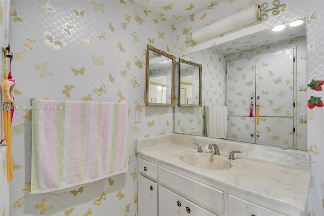 4350 Hillcrest Dr Unit 306, Hollywood, FL 33021 - bathroom with vanity and wallpapered walls