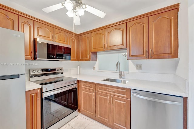4341 NW 16th St Unit 203, Lauderhill, FL 33313 - kitchen featuring appliances with stainless steel finishes, ceiling fan, light countertops, and light tile patterned floors