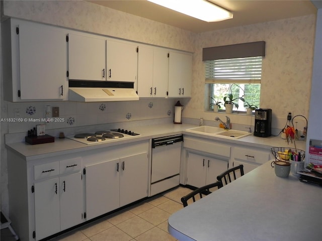 8225 SW 97th St, Miami, FL 33156 - kitchen with white appliances, under cabinet range hood, light countertops, white cabinets, and wallpapered walls