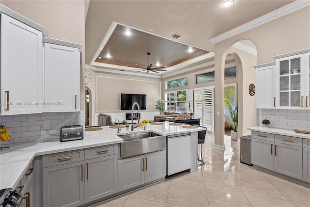 8346 SW 51st St, Davie, FL 33328 - kitchen with gray cabinetry, crown molding, dishwasher, arched walkways, and a tray ceiling