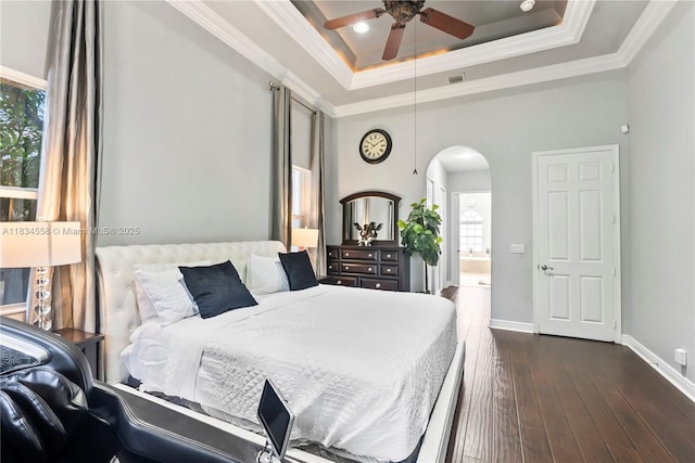 8346 SW 51st St, Davie, FL 33328 - bedroom with arched walkways, a raised ceiling, dark wood-style floors, and ornamental molding
