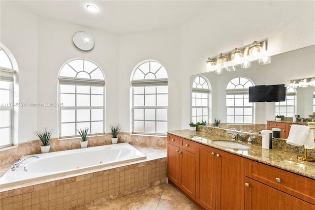 8346 SW 51st St, Davie, FL 33328 - full bathroom featuring vanity, a tub with jets, and tile patterned flooring