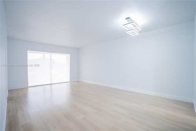 9601 Sunrise Lakes Blvd Unit 311, Sunrise, FL 33322 - unfurnished room with light wood-style floors and baseboards