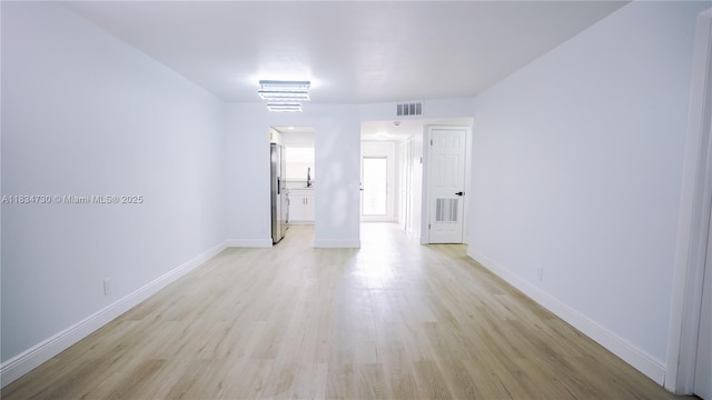 9601 Sunrise Lakes Blvd Unit 311, Sunrise, FL 33322 - empty room with light wood finished floors and baseboards