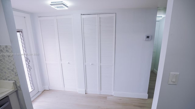 9601 Sunrise Lakes Blvd Unit 311, Sunrise, FL 33322 - hallway with baseboards and light wood-style flooring
