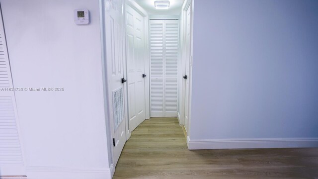 9601 Sunrise Lakes Blvd Unit 311, Sunrise, FL 33322 - corridor with wood finished floors and baseboards