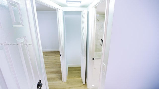 9601 Sunrise Lakes Blvd Unit 311, Sunrise, FL 33322 - hall featuring light wood-type flooring and baseboards