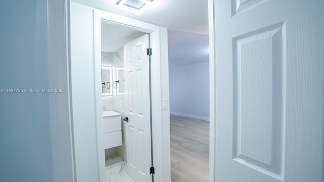 9601 Sunrise Lakes Blvd Unit 311, Sunrise, FL 33322 - hall with baseboards and wood finished floors