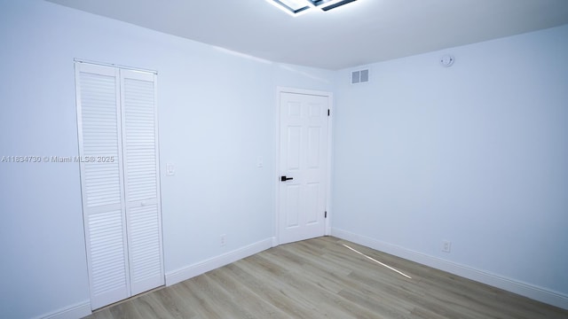9601 Sunrise Lakes Blvd Unit 311, Sunrise, FL 33322 - unfurnished bedroom featuring wood finished floors and a closet