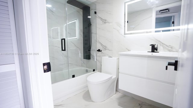 9601 Sunrise Lakes Blvd Unit 311, Sunrise, FL 33322 - full bath featuring marble finish flooring, vanity, and combined bath / shower with glass door