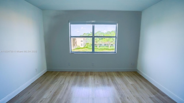 9601 Sunrise Lakes Blvd Unit 311, Sunrise, FL 33322 - unfurnished room featuring wood finished floors and baseboards