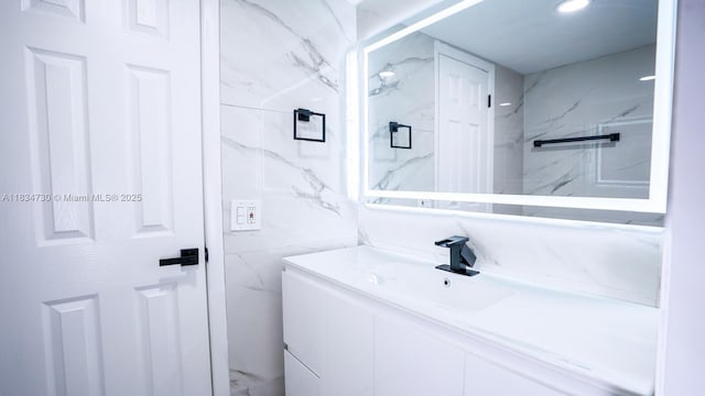 9601 Sunrise Lakes Blvd Unit 311, Sunrise, FL 33322 - bathroom featuring vanity and tile walls