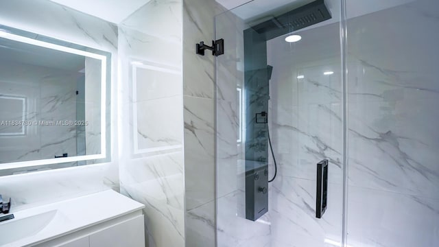 9601 Sunrise Lakes Blvd Unit 311, Sunrise, FL 33322 - bathroom with a marble finish shower, vanity, and tile walls