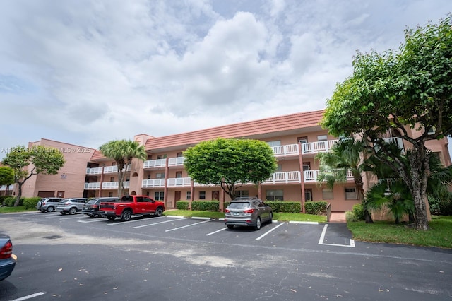 9601 Sunrise Lakes Blvd Unit 311, Sunrise, FL 33322 - view of apartment building / complex featuring uncovered parking