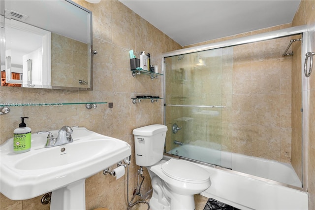 401 Ocean Dr Unit 1024, Miami Beach, FL 33139 - bathroom featuring combined bath / shower with glass door and tile walls
