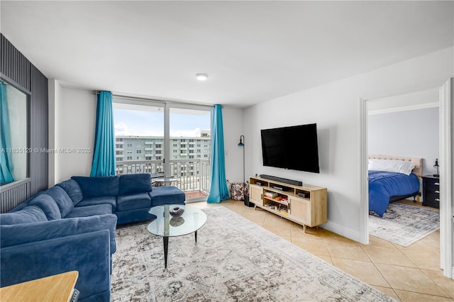 401 Ocean Dr Unit 1024, Miami Beach, FL 33139 - living room featuring light tile patterned flooring and floor to ceiling windows