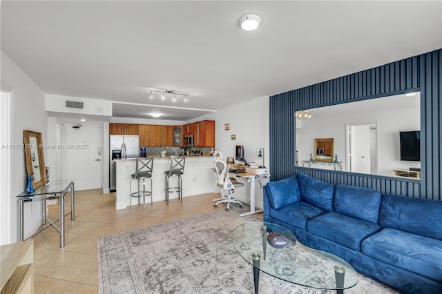 401 Ocean Dr Unit 1024, Miami Beach, FL 33139 - living area with light tile patterned floors and an office area