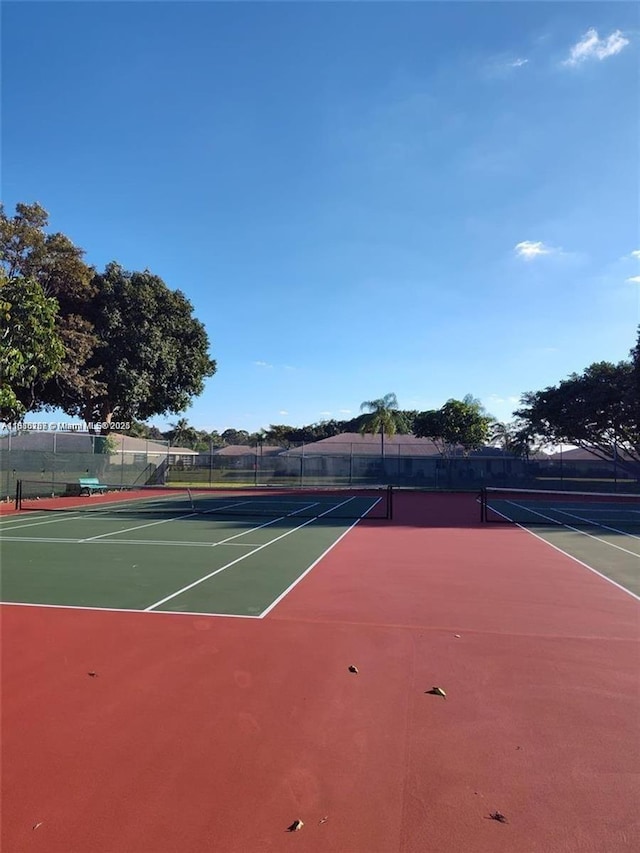 5054 Lakefront Blvd Unit A, Delray Beach, FL 33484 - view of tennis court with community basketball court