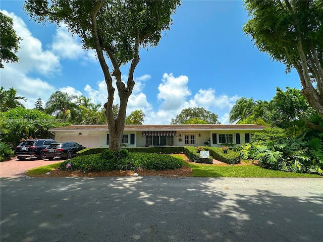 8225 SW 151st St, Palmetto Bay, FL 33158 - ranch-style home featuring driveway and an attached garage