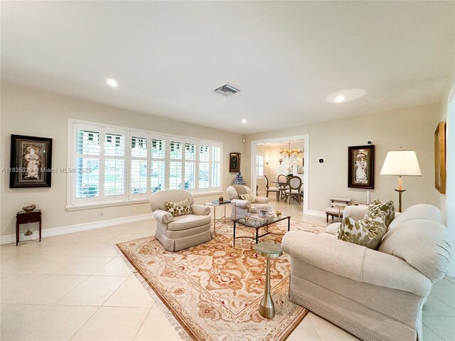 8225 SW 151st St, Palmetto Bay, FL 33158 - living room with light tile patterned floors, recessed lighting, and a chandelier