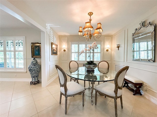 8225 SW 151st St, Palmetto Bay, FL 33158 - dining area with a chandelier, a decorative wall, and light tile patterned flooring