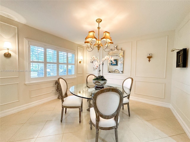 8225 SW 151st St, Palmetto Bay, FL 33158 - dining room with a decorative wall, a chandelier, and light tile patterned floors