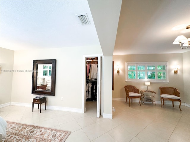 8225 SW 151st St, Palmetto Bay, FL 33158 - bedroom featuring a spacious closet, light tile patterned floors, and a closet