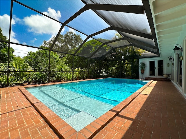 8225 SW 151st St, Palmetto Bay, FL 33158 - swimming pool with french doors, a patio area, and a lanai
