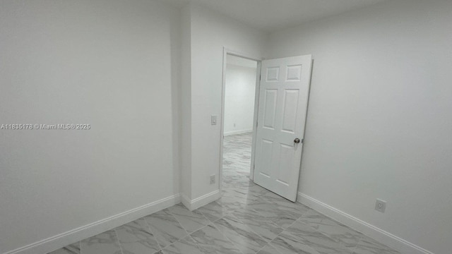 2251 NW 48th Ter Unit 214, Lauderhill, FL 33313 - unfurnished room featuring light marble finish floors and baseboards