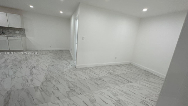 2251 NW 48th Ter Unit 214, Lauderhill, FL 33313 - unfurnished room with recessed lighting and light marble finish floors