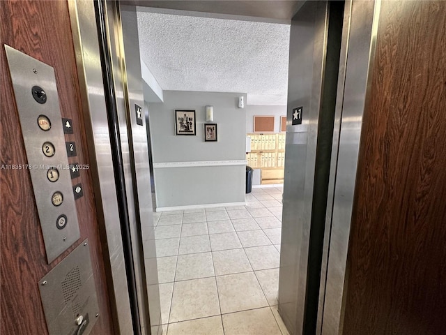 2251 NW 48th Ter Unit 214, Lauderhill, FL 33313 - corridor featuring light tile patterned flooring and a textured ceiling