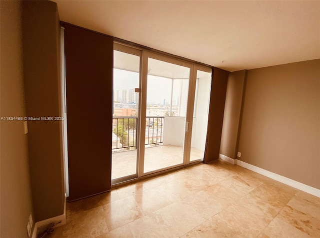 3545 NE 166th St Unit 805, North Miami Beach, FL 33160 - empty room featuring baseboards