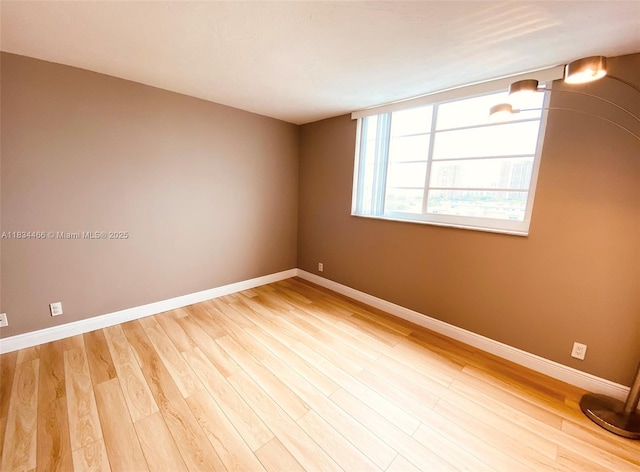 3545 NE 166th St Unit 805, North Miami Beach, FL 33160 - empty room featuring wood finished floors