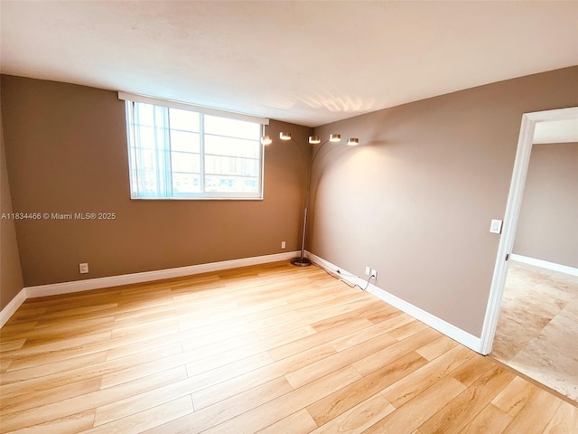 3545 NE 166th St Unit 805, North Miami Beach, FL 33160 - empty room featuring light wood-style flooring and baseboards