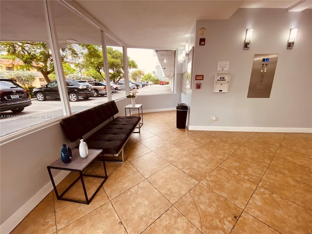 3545 NE 166th St Unit 805, North Miami Beach, FL 33160 - living area with light tile patterned floors and baseboards