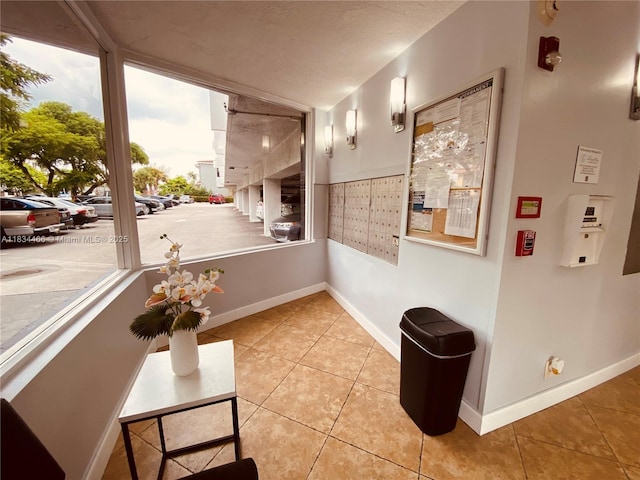 3545 NE 166th St Unit 805, North Miami Beach, FL 33160 - hallway with light tile patterned floors