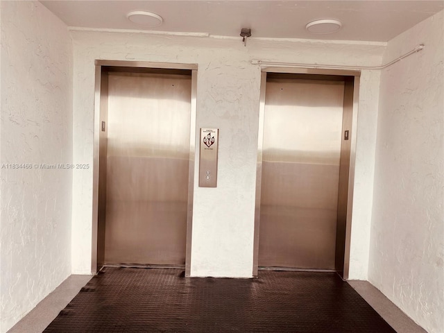 3545 NE 166th St Unit 805, North Miami Beach, FL 33160 - corridor featuring elevator and a textured wall