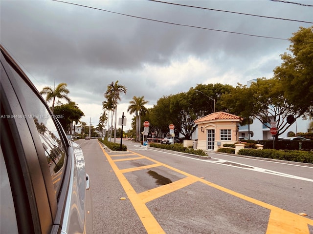 3545 NE 166th St Unit 805, North Miami Beach, FL 33160 - view of asphalt road with traffic signs and street lighting